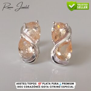 Par de aretes de plata con una piedra de citrino tallada en forma de gota.